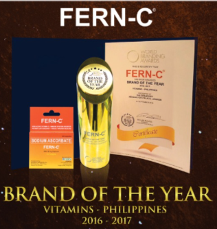 fern-c next to the gold brand of the year award 